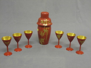 A 7 piece 1930's Oriental red lacquered cocktail set with cocktail shaker and 6 cocktail glasses decorated cockerel in tree