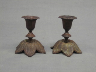 A pair of metal stub candlesticks in the form of flower petals 4"