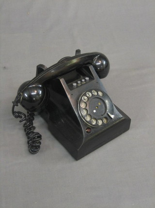 A 1950's black Bakelite dial telephone (f)