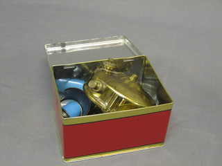 A brass Primus stove complete with tin