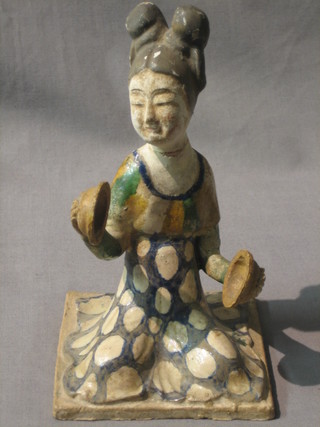 An Eastern "terracotta" figure of a seated musician with cymbals 7" (head f and r)