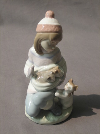 A Lladro figure Friday's Child in the form of a seated girl with kittens 6"