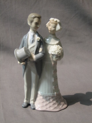 A Lladro figure in the form of bride and groom, base marked 4808, 8"