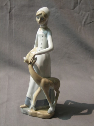A Casades figure of a standing lady with deer 10"