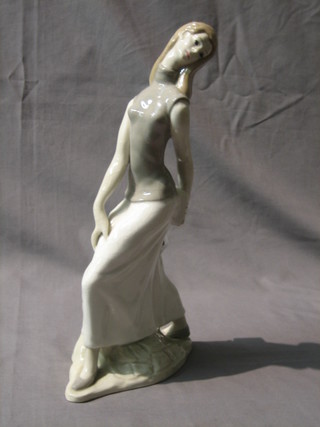 A Peyro figure of a standing walking girl 13"