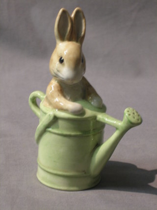 A Beswick Royal Doulton Beatrix Potter figure Peter In The Watering Can, black mark 1999