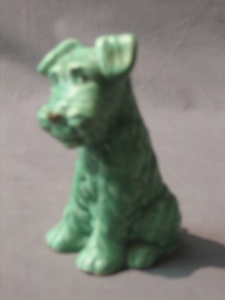 A green glazed Sylvac figure of a seated dog 5"