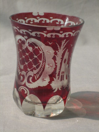 A red etched Bohemian glass beaker decorated a running stag 4"