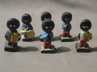 A six piece Robinson's Gollywog band and a German porcelain boat shaped dish 7"