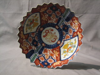 A good 19th Century Japanese Imari porcelain circular plate with wavy border and panelled decoration 11"
