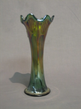 A green Carnival glass vase with wavy border and reeded form 9 1/2"