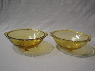 A pair of Sowerby amber glass bowls 8" diameter