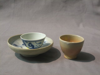 An Oriental provincial saucer dish with blue and white decoration 5" and a Oriental blue and white tea bowl 2" and 1 other