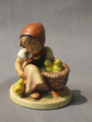 A Goebel figure of a seated bonnetted girl with basket of chicks 3 1/2"