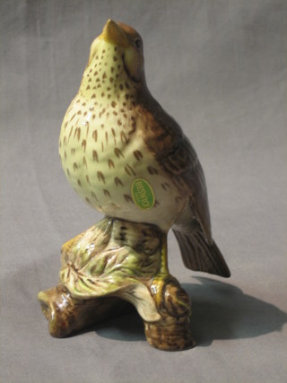 A Beswick figure of a seated thrush, the base marked Beswick England 2308 6"