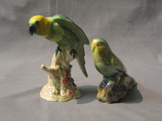 A Beswick figure of a green Parrot the base marked Beswick England 930 6 1/2" (chip to end of tail) together with a KSP figure of a budgerigar 3"