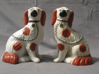 A pair of 19th Century style Staffordshire figures of seated Spaniels 9"