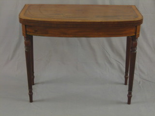 An Edwardian mahogany D shaped card table with crossbanded top and satinwood stringing, raised and reeded supports 36"