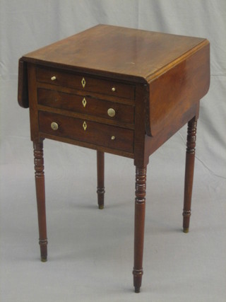 A 19th Century mahogany drop flap work table, fitted 3 long drawers with ivory escutcheons and turned ivory handles, raised on turned supports 16" (4 handles f)