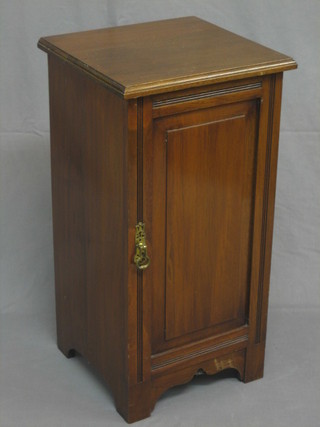 A 19th Century walnut pot cupboard enclosed by a panelled door, raised on bracket feet 14"