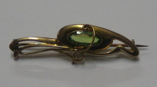 A lady's 9ct gold bar brooch set a peridot