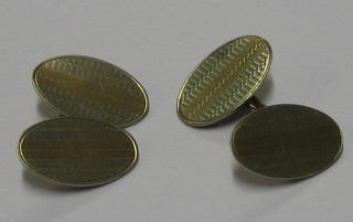 A pair of 9ct 2 colour gold oval cufflinks