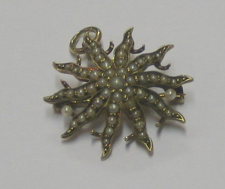 An Edwardian 14ct gold Starburst pendant/brooch set demi-pearls