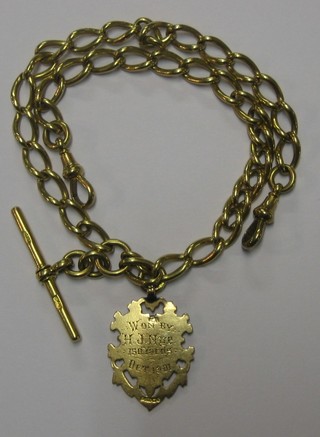 An 18ct gold double Albert fetter link watch chain, hung a 9ct gold watch chain medallion 15", 2 ozs