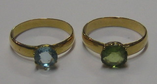 2 gilt metal rings set blue and green stones