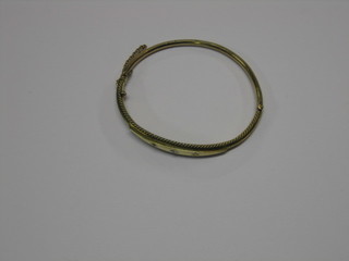 A gilt metal bracelet set 3 white stones