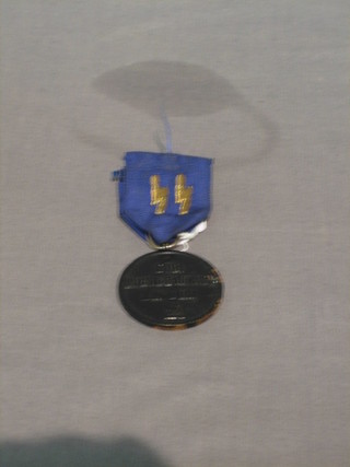 A Nazi German black painted bronze medal with blue ribbon and gold Thunderbolts, the reverse marked Fur Treue Dinsti Inder