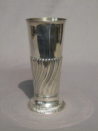 A Victorian waisted and embossed silver vase, raised on a circular spreading foot Sheffield 1862, 4 ozs