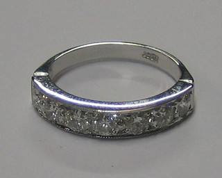 A lady's 18ct half eternity ring set 7 diamonds (approx 1 ct)