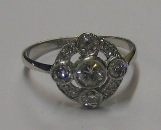 An 18ct white gold dress ring set 3 large diamonds supported by numerous diamonds (approx 0.91ct)