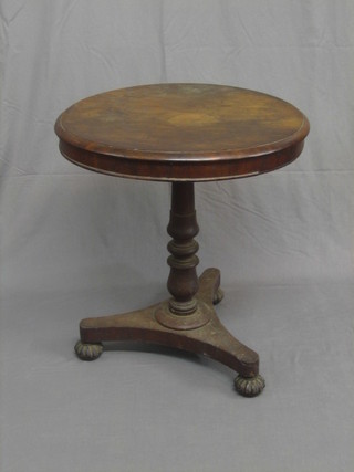A circular William IV mahogany occasional table, raised on a turned column with triform base, raised on bun feet 27"