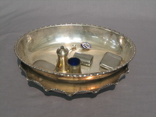 A circular oval silver plated platter 10", an oval silver plated dish 9", 2 silver vesta cases, a travelling inkwell and etc