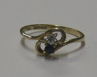 A 9ct gold dress ring set a sapphire and diamond