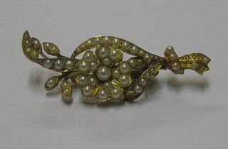 A gilt metal brooch set demi-pearls