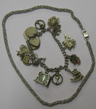 A silver curb link charm bracelet hunt numerous charms and a silver chain (2)