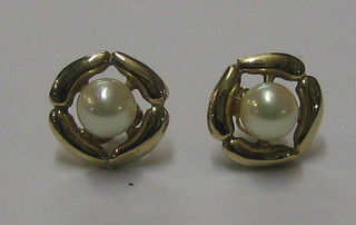 A pair of "pearl" stud earrings