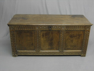An 18th Century carved oak coffer of panelled construction with hinged lid and arcaded decoration 54"