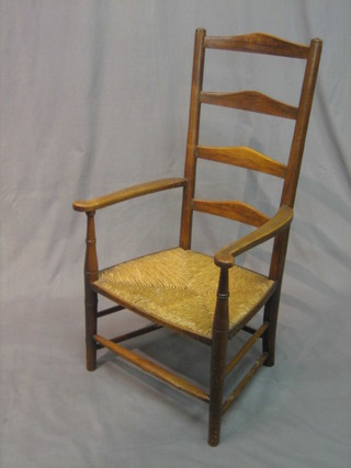 An elm ladder back carver chair with woven cane seat (arms f and r)