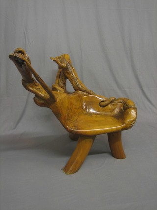 A 20th Century Designer carved root wood chair in the form of a mythical beast