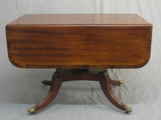 A 19th Century mahogany Pembroke pedestal table with crossbanded top, raised on a square column with triform base and scrolled feet 40"