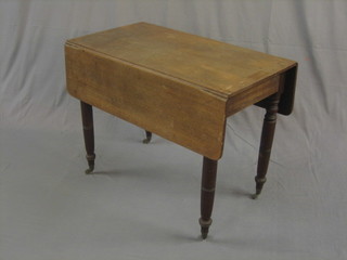 A 19th Century mahogany Pembroke table, raised on turned supports 36"