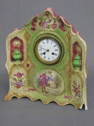 An Edwardian French 8 day striking mantel clock contained in an ornate pottery case (foot f and chip to top)