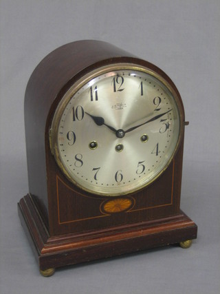 An Edwardian 8 day chiming bracket clock with silvered dial contained in an arch shaped inlaid mahogany case by J B Yabsley of Ludgate Hill