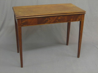 A Georgian mahogany rectangular tea table, raised on square tapering supports 36"