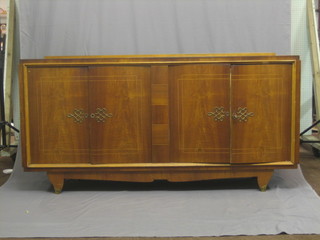 An Art Deco French inlaid walnut sideboard, the cupboards enclosed by a panelled door 78"