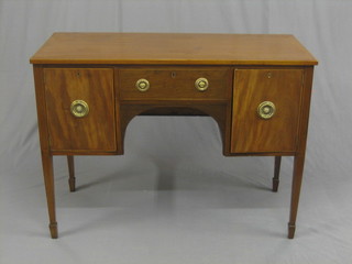 An Edwardian, Georgian style mahogany sideboard fitted 1 long drawer flanked by a pair of cupboards, raised on square tapering supports ending in spade feet 44"